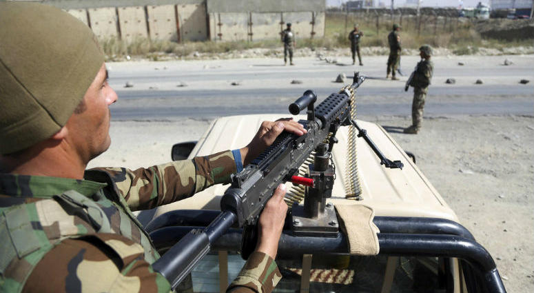 In this Wednesday, Oct. 17, 2018, photo, Afghan National Army soldiers stand guard at a checkpoint in Kabul, Afghanistan. In this Wednesday, Oct. 17, 2018, photo, Afghan National Army soldiers stand guard at a checkpoint in Kabul, Afghanistan.