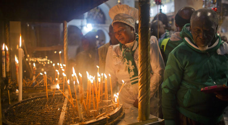Christian worshippers light candles at the Church of the Nativity, traditionally recognized by Christians to be the birthplace of Jesus Christ, in the West Bank city of Bethlehem, Sunday, Dec. 23, 2018. Christian worshippers light candles at the Church of the Nativity, traditionally recognized by Christians to be the birthplace of Jesus Christ, in the West Bank city of Bethlehem, Sunday, Dec. 23, 2018.