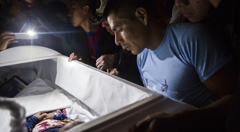 Family members pay their final respects to 7-year-old Jakelin Caal Maquin during a memorial service in her grandparent's home in San Antonio Secortez, Guatemala, Monday, Dec. 24, 2018. Family members pay their final respects to 7-year-old Jakelin Caal Maquin during a memorial service in her grandparent's home in San Antonio Secortez, Guatemala, Monday, Dec. 24, 2018.