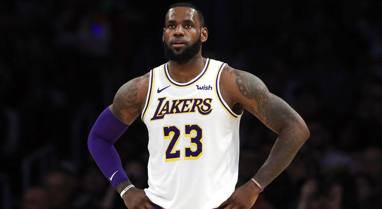 In this Dec. 23, 2018, file photo, Los Angeles Lakers' LeBron James stands during the first half of an NBA basketball game against the Memphis Grizzlies in Los Angeles. LeBron James