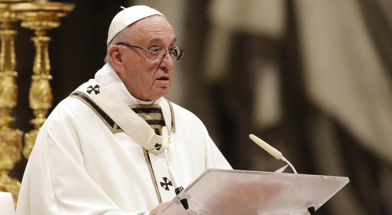 Pope Francis delivers his message as he celebrates the Christmas Eve Mass in St. Peter's Basilica at the Vatican, Monday, Dec. 24, 2018. Pope Francis