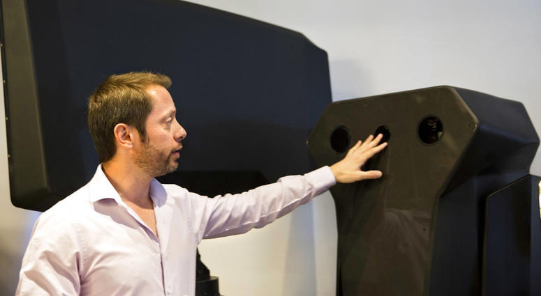 Product manager Asaf Lebovitz from the Israeli anti-drone company Skylock, explains their system's main unit at the company's offices in Petah Tikvah, Israel, Tuesday, Dec. 25, 2018. Product manager Asaf Lebovitz from the Israeli anti-drone company Skylock.