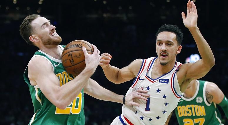 Boston Celtics' Gordon Hayward (20) is defended by Philadelphia 76ers' Landry Shamet (1) during the first half of an NBA basketball game in Boston, Tuesday, Dec. 25, 2018. Boston Celtics' Gordon Hayward (20) is defended by Philadelphia 76ers' Landry Shamet (1) during the first half of an NBA basketball game in Boston, Tuesday, Dec. 25, 2018.