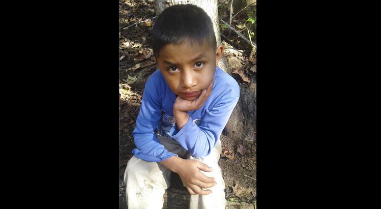 This Dec, 12, 2018 photo provided by Catarina Gomez on Thursday, Dec. 27, 2018, shows her half-brother Felipe Gomez Alonzo, 8, near her home in Yalambojoch, Guatemala. Felipe Gomez Alonzo