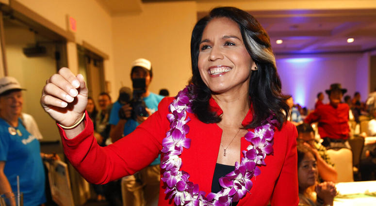 In this Nov. 6, 2018, file photo, Rep. Tulsi Gabbard, D-Hawaii, greets supporters in Honolulu. Tulsi Gabbard