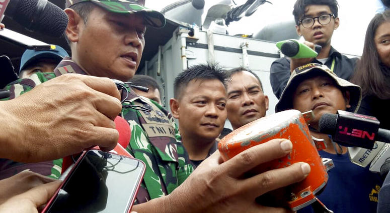 Indonesian Navy Commander Rear Admiral Yudo Margin shows the recovered cockpit voice recorder of Lion Air flight 610 during a press conference on board the navy ship KRI Spica in the waters off Tanjung Karawang, Indonesia, Jan. 14, 2019. Indonesian Navy Commander Rear Admiral Yudo Margin shows the recovered cockpit voice recorder of Lion Air flight 610 during a press conference on board the navy ship KRI Spica in the waters off Tanjung Karawang, Indonesia, Jan. 14, 2019.