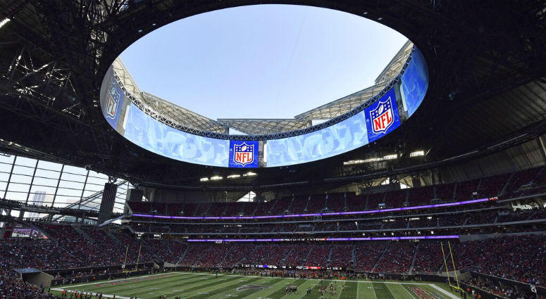 In this Sunday, Dec. 2, 2018, photo, the Atlanta Falcons play the Baltimore Ravens in the Mercedes-Benz stadium during the second half of an NFL football game, in Atlanta. In this Sunday, Dec. 2, 2018, photo, the Atlanta Falcons play the Baltimore Ravens in the Mercedes-Benz stadium during the second half of an NFL football game, in Atlanta.
