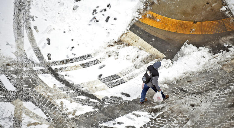 A pedestrian walks across the street in downtown Scranton, Pa., on Sunday, Jan. 20, 2019. A pedestrian walks across the street in downtown Scranton, Pa., on Sunday, Jan. 20, 2019.