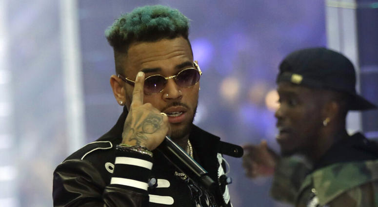 In this Sept.21, 2018 file photo, singer Chris Brown performs during Philipp Plein's women's 2019 Spring-Summer collection, unveiled during the Fashion Week in Milan, Italy. Chris Brown