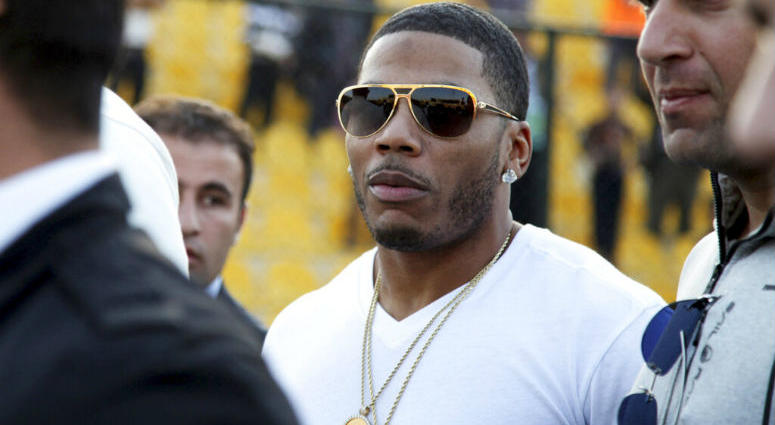 FILE- In this March 13, 2015 file photo, rapper Nelly approaches the stage for a concert in Irbil, northern Iraq. FILE- In this March 13, 2015 file photo, rapper Nelly approaches the stage for a concert in Irbil, northern Iraq.