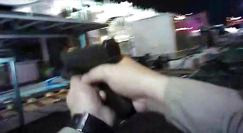 In this Oct. 1, 2017, file image taken from police body cam video released by the Las Vegas Metropolitan Police Department on July 25, 2018, an armed law enforcement official points his gun while searching for a shooter in Las Vegas. In this Oct. 1, 2017, file image taken from police body cam video released by the Las Vegas Metropolitan Police Department on July 25, 2018, an armed law enforcement official points his gun while searching for a shooter in Las Vegas.