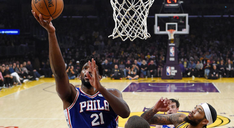 Philadelphia 76ers center Joel Embiid, left, shoots as Los Angeles Lakers forward Brandon Ingram, right, defends during the first half of an NBA basketball game Tuesday, Jan. 29, 2019, in Los Angeles. Philadelphia 76ers center Joel Embiid, left, shoots as Los Angeles Lakers forward Brandon Ingram, right, defends during the first half of an NBA basketball game Tuesday, Jan. 29, 2019, in Los Angeles.