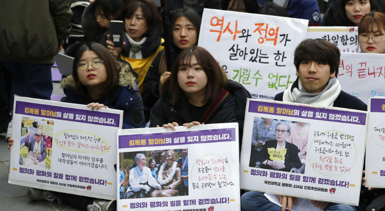 Participants hold pictures of deceased Kim Bok-dong, one of former South Korean sex slaves who were forced to serve for the Japanese military in World War II, during a weekly rally near the Japanese Embassy in Seoul, South Korea, Wednesday, Jan. 30, 2019. Participants hold pictures of deceased Kim Bok-dong, one of former South Korean sex slaves who were forced to serve for the Japanese military in World War II, during a weekly rally near the Japanese Embassy in Seoul, South Korea, Wednesday, Jan. 30, 2019.