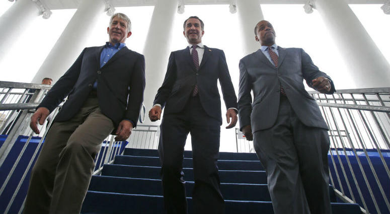 FILE - In this Jan. 12, 2018 file photo, Virginia Gov.-elect, Lt. Gov Ralph Northam, center, walks down the reviewing stand with Lt. Gov-elect, Justin Fairfax, right, and Attorney General Mark Herring at the Capitol in Richmond, Va. FILE - In this Jan. 12, 2018 file photo, Virginia Gov.-elect, Lt. Gov Ralph Northam, center, walks down the reviewing stand with Lt. Gov-elect, Justin Fairfax, right, and Attorney General Mark Herring at the Capitol in Richmond, Va.