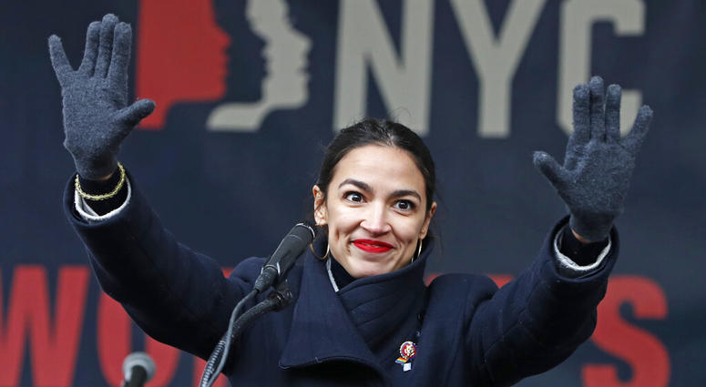 In this Jan. 19, 2019, file photo, U.S. Rep. Alexandria Ocasio-Cortez, (D-New York) waves to the crowd after speaking at Women's Unity Rally in Lower Manhattan in New York. U.S. Rep. Alexandria Ocasio-Cortez