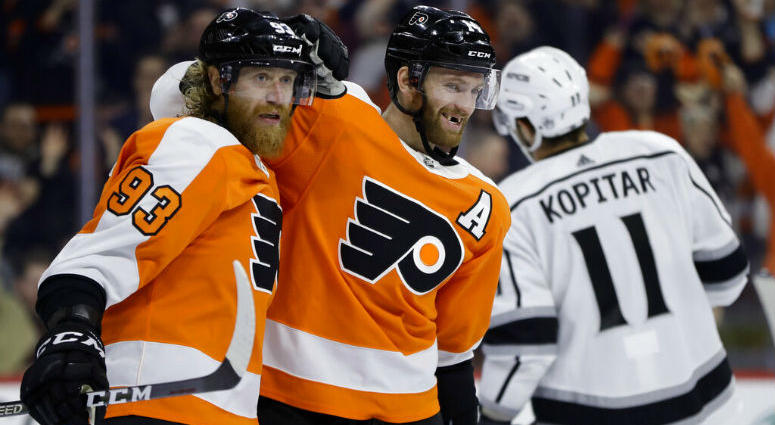 Philadelphia Flyers' Sean Couturier, center, celebrates with Jakub Voracek, left, past Los Angeles Kings' Anze Kopitar after Couturier's goal during the second period of an NHL hockey game, Thursday, Feb. 7, 2019, in Philadelphia. Philadelphia Flyers' Sean Couturier, center, celebrates with Jakub Voracek, left, past Los Angeles Kings' Anze Kopitar after Couturier's goal during the second period of an NHL hockey game, Thursday, Feb. 7, 2019, in Philadelphia.