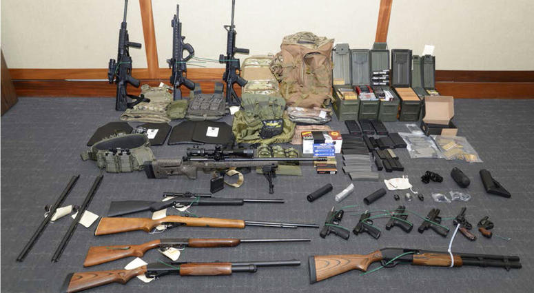 This image provided by the U.S. District Court in Maryland shows a photo of firearms and ammunition that was in the motion for detention pending trial in the case against Christopher Paul Hasson. This image provided by the U.S. District Court in Maryland shows a photo of firearms and ammunition that was in the motion for detention pending trial in the case against Christopher Paul Hasson.