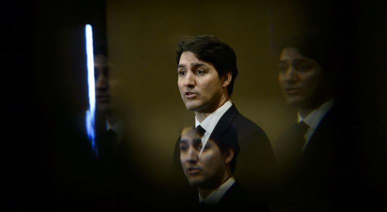 FILE - In this March 8, 2019, file photo, Prime Minister Justin Trudeau is seen through a beveled pane of glass in a door as he takes part in a news conference in Iqaluit, Nunavut, Canada. FILE - In this March 8, 2019, file photo, Prime Minister Justin Trudeau is seen through a beveled pane of glass in a door as he takes part in a news conference in Iqaluit, Nunavut, Canada.