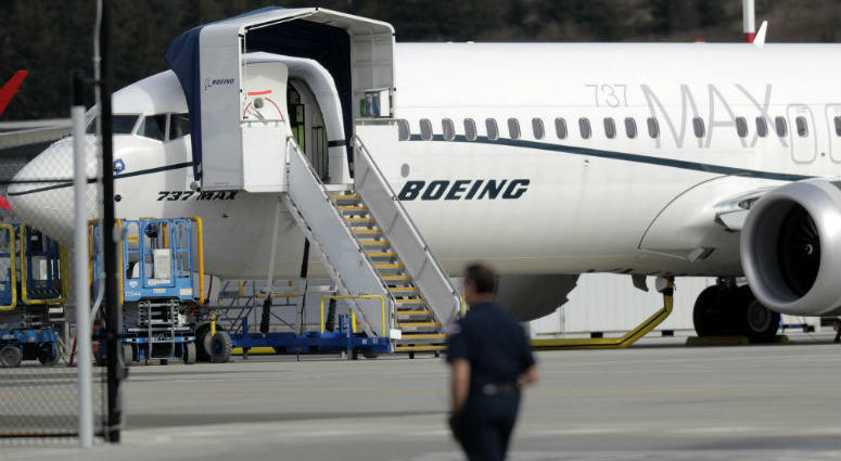 A worker walks next to a Boeing 737 MAX 8 airplane parked at Boeing Field, Thursday, March 14, 2019, in Seattle. A worker walks next to a Boeing 737 MAX 8 airplane parked at Boeing Field, Thursday, March 14, 2019, in Seattle.