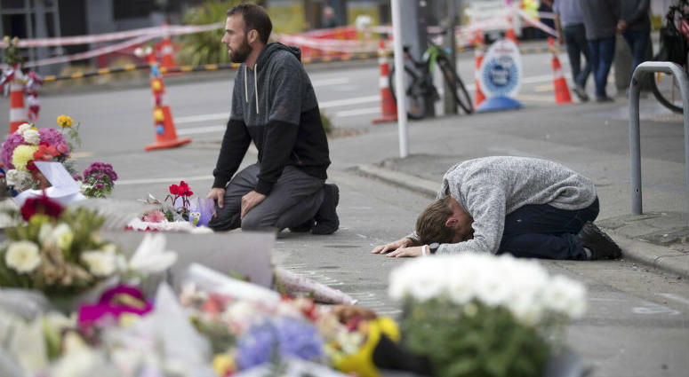 Mourners pray near the Linwood mosque in Christchurch, New Zealand, Tuesday, March 19, 2019. Mourners pray near the Linwood mosque in Christchurch, New Zealand.