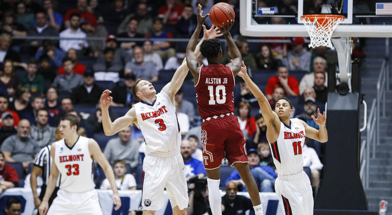 Temple's Shizz Alston Jr. (10) shoots against Belmont's Dylan Windler (3) and Kevin McClain (11) during the first half of a First Four game of the NCAA college basketball tournament, Tuesday, March 19, 2019, in Dayton, Ohio. Temple's Shizz Alston Jr. (10) shoots against Belmont's Dylan Windler (3) and Kevin McClain (11).