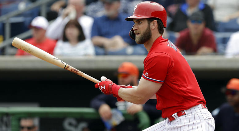 Philadelphia Phillies' Bryce Harper watches his single off Detroit Tigers starting pitcher Spencer Turnbull during the fourth inning of a spring training baseball game Wednesday, March 20, 2019, in Clearwater, Fla. Bryce Harper