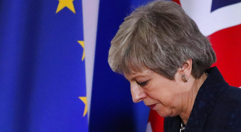 British Prime Minister Theresa May leaves after addressing a media conference at an EU summit in Brussels. British Prime Minister Theresa May leaves after addressing a media conference at an EU summit in Brussels, March 22, 2019.