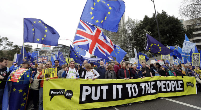 Demonstrators hold a banner during a Peoples Vote anti-Brexit march in London, Saturday, March 23, 2019. The march, organized by the People's Vote campaign is calling for a final vote on any proposed Brexit deal. Demonstrators hold a banner during a Peoples Vote anti-Brexit march in London, Saturday, March 23, 2019. The march, organized by the People's Vote campaign is calling for a final vote on any proposed Brexit deal.