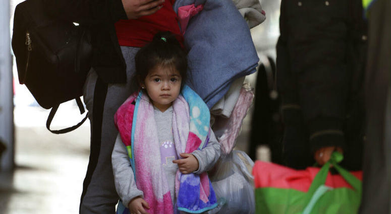 Immigrants from Central America seeking asylum board a bus, Tuesday, April 2, 2019, in downtown San Antonio. The surge of migrants arriving at the southern border has led the Trump administration to dramatically expand a practice it has long mocked as "catch and release."