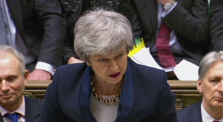 In this grab taken from video, Britain's Prime Minister Theresa May speaks during Prime Minister's Questions in the House of Commons, London, Wednesday April 3, 2019. With Britain racing toward a chaotic exit from the European Union within days, May veered away from the cliff-edge Tuesday, saying she would seek another Brexit delay and hold talks with the opposition to seek a compromise.