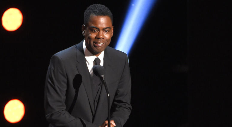 In this March 30, 2019 file photo, Chris Rock presents the award for outstanding comedy series at the 50th annual NAACP Image Awards at the Dolby Theatre in Los Angeles. Chris Rock