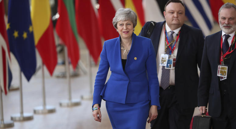 An anti-Brexit campaigner holds a sign in front of an EU flag during a protest outside EU headquarters in Brussels, Wednesday, April 10, 2019. European Union leaders meet Wednesday in Brussels for an emergency summit to discuss a new Brexit extension. An anti-Brexit campaigner holds a sign in front of an EU flag during a protest outside EU headquarters in Brussels, Wednesday, April 10, 2019. European Union leaders meet Wednesday in Brussels for an emergency summit to discuss a new Brexit extension.