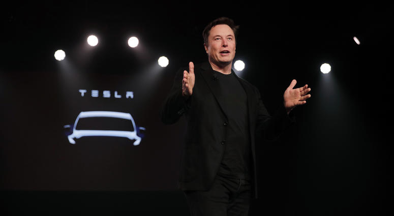 In this March 14, 2019, file photo Tesla CEO Elon Musk speaks before unveiling the Model Y at Tesla's design studio in Hawthorne, Calif. Tesla CEO Elon Musk