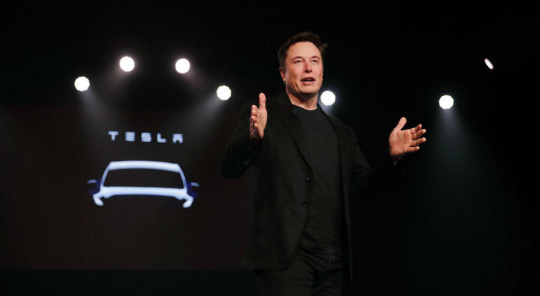 FILE- In this March 14, 2019, file photo Tesla CEO Elon Musk speaks before unveiling the Model Y at Tesla's design studio in Hawthorne, Calif. Elon Musk appears poised to transform the company’s electric cars into driverless vehicles in a risky bid to realize a bold vision that he has been floating for years.