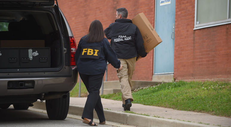 Federal agents arrive at the Maryland Center for Adult Training in Baltimore, April 25, 2019. Agents with the FBI and IRS are gathering evidence inside the two homes of Mayor Catherine Pugh and in City Hall. Baltimore Mayor Catherine Pugh