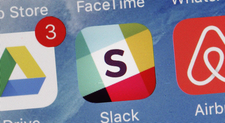 In this Tuesday, Jan. 31, 2017, file photo, the Slack app is displayed on a mobile phone in New York. In this Tuesday, Jan. 31, 2017, file photo, the Slack app is displayed on a mobile phone in New York.