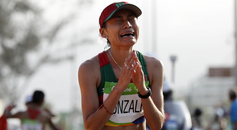 In this Friday, Aug. 19, 2016 file photo, Maria Guadalupe Gonzalez of Mexico, reacts after crossing the finish line in second place in the women's 20-km race walk at the 2016 Summer Olympics in Rio de Janeiro, Brazil. Maria Guadalupe Gonzalez