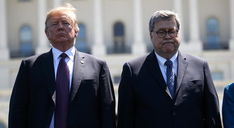 President Donald Trump stands with Attorney General William Barr during the 38th Annual National Peace Officers' Memorial Service at the U.S. Capitol, Wednesday, May 15, 2019, in Washington. President Donald Trump stands with Attorney General William Barr.