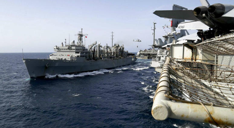 In this Sunday, May 19, 2019, photo released by the U.S. Navy, the fast combat support ship USNS Arctic transports cargo to the Nimitz-class aircraft carrier USS Abraham Lincoln during a replenishment-at-sea in the Arabian Sea. In this Sunday, May 19, 2019, photo released by the U.S. Navy, the fast combat support ship USNS Arctic transports cargo to the Nimitz-class aircraft carrier USS Abraham Lincoln during a replenishment-at-sea in the Arabian Sea.