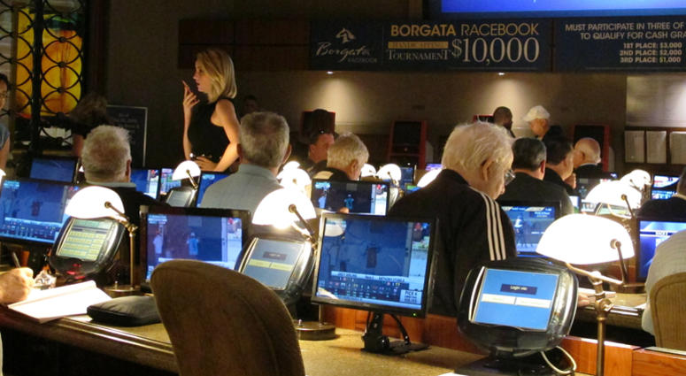 This June 14, 2018 file photo shows bettors waiting to make wagers on sporting events at the Borgata casino in Atlantic City hours after it began accepting sports bets. Borgata casino in Atlantic City