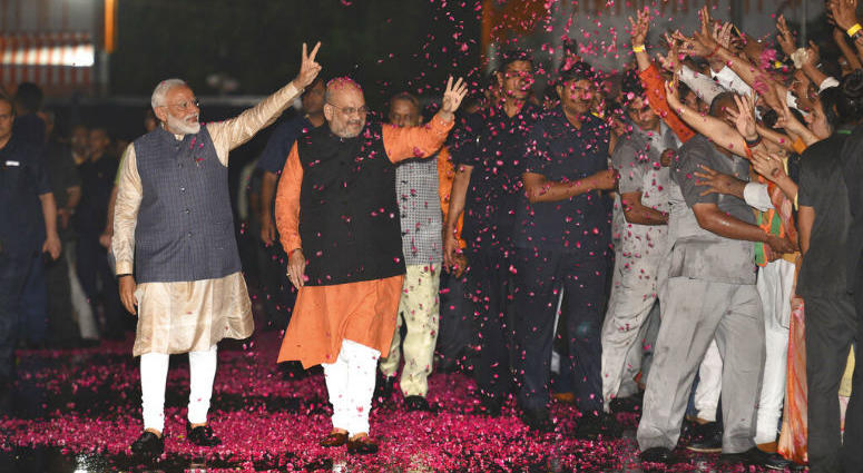 Indian Prime Minister Narendra Modi and Bharatiya Janata Party (BJP) President Amit Shah greet supporters on arrival at the party headquarters in New Delhi, India, Thursday, May 23, 2019. Modi's Hindu nationalist party claimed it won reelection with a commanding lead in Thursday's vote count, while the head of the main opposition party conceded a personal defeat that signaled the end of an era for modern India's main political dynasty.