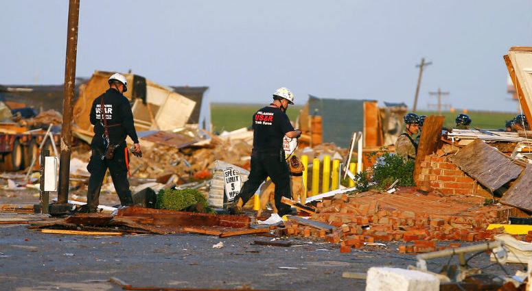 Workers look through tornado damage at the American Budget Value Inn in El Reno, Okla., Sunday, May 26, 2019. The deadly tornado leveled a motel and tore through the mobile home park near Oklahoma City overnight Workers look through tornado damage at the American Budget Value Inn in El Reno, Okla., Sunday, May 26, 2019. The deadly tornado leveled a motel and tore through the mobile home park near Oklahoma City overnight