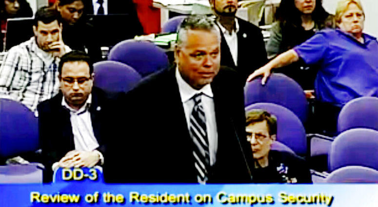 FILE - In this Feb. 18, 2015, file frame from video from Broward County Public Schools, school resource officer Scot Peterson talks during a school board meeting of Broward County, Fla. Peterson, the then-Florida sheriff's deputy assigned to protect the h State Attorney Mike Satz announced that 56-year-old Peterson faces child neglect, culpable negligence and perjury charges.