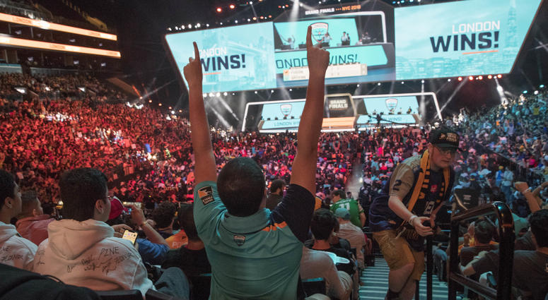 In this July 28, 2018, file photo, London Spitfire fan Rick Ybarra, of Plainfield, Ind., reacts after London won the second game against the Philadelphia Fusion during the Overwatch League Grand Finals competition at Barclays Center in New York. In this July 28, 2018, file photo, London Spitfire fan Rick Ybarra, of Plainfield, Ind., reacts after London won the second game against the Philadelphia Fusion during the Overwatch League Grand Finals competition at Barclays Center in New York.