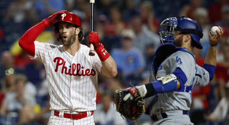 Philadelphia Phillies' Bryce Harper, left, reacts after striking out against Los Angeles Dodgers relief pitcher Julio Urias during the fourth inning of a baseball game Wednesday, July 17, 2019, in Philadelphia. Philadelphia Phillies' Bryce Harper, left, reacts after striking out against Los Angeles Dodgers relief pitcher Julio Urias during the fourth inning of a baseball game Wednesday, July 17, 2019, in Philadelphia.