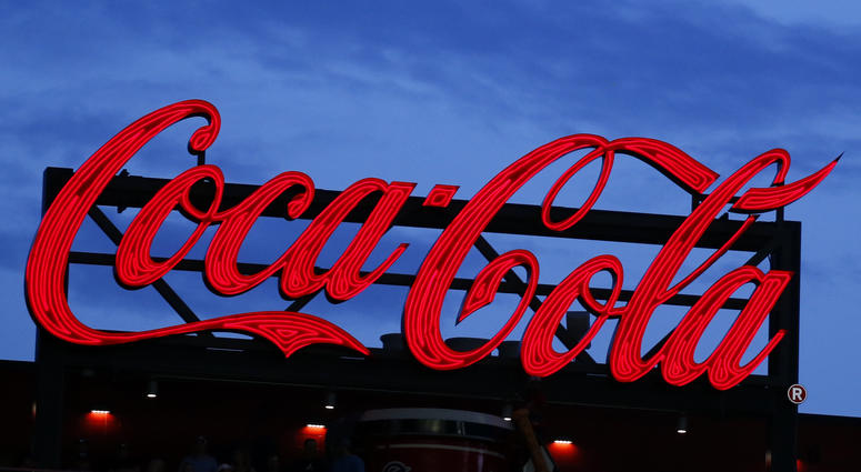 In this July 20, 2019, photo a Coca-Cola billboard is shown over left field at SunTrust Park during a baseball game between the Washington Nationals and Atlanta Braves in Atlanta. In this July 20, 2019, photo a Coca-Cola billboard is shown over left field at SunTrust Park during a baseball game between the Washington Nationals and Atlanta Braves in Atlanta.