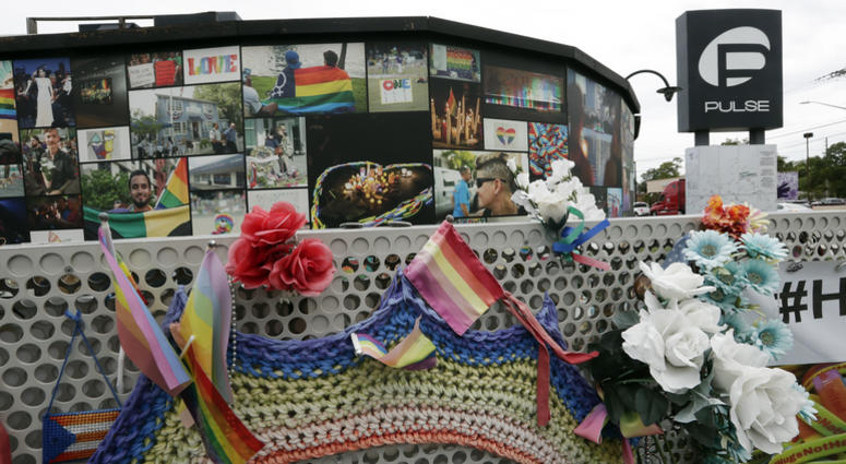This June 10, 2019, file photo shows an outside view of the Pulse nightclub temporary memorial before a news conference to introduce legislation that would designate the Pulse nightclub site as a national memorial in Orlando, Fla. Pulse nightclub memorial