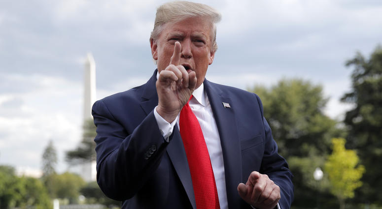 President Donald Trump speaks to members of the media at the White House in Washington, Wednesday, July 24, 2019, as he departs for a short trip to Andrews Air Force Base, Md., and onto Wheeling, W.Va., for a fundraiser. President Donald Trump