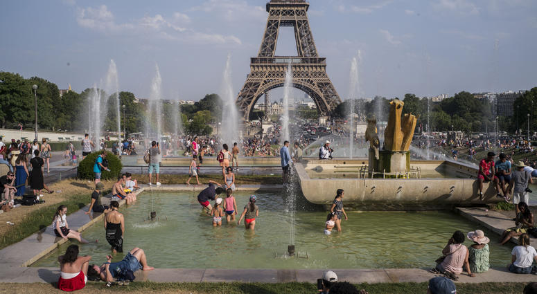 People enjoy the sun and the fountains of the Trocadero gardens in Paris, Thursday July 25, 2019, when a new all-time high temperature of 42.6 degrees Celsius (108.7 F) hit the French capital. People enjoy the sun and the fountains of the Trocadero gardens in Paris, Thursday July 25, 2019, when a new all-time high temperature of 42.6 degrees Celsius (108.7 F) hit the French capital.