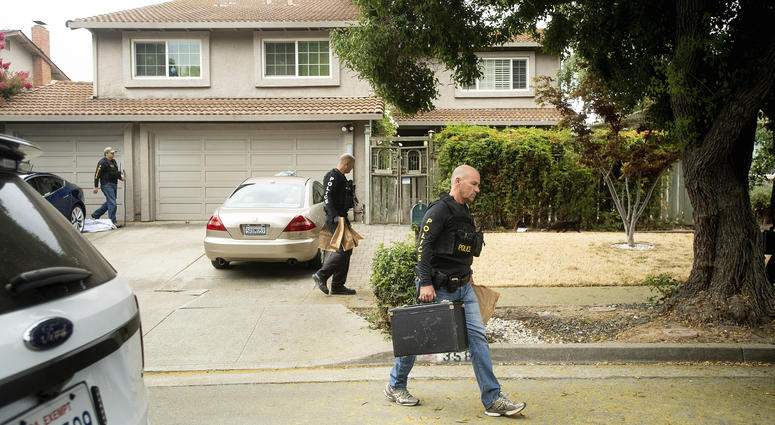 Police officers carry evidence bags from the family home of Gilroy Garlic Festival gunman Santino William Legan, Monday, July, 29, 2019, in Gilroy, Calif. Police search home of Santino William Legan.